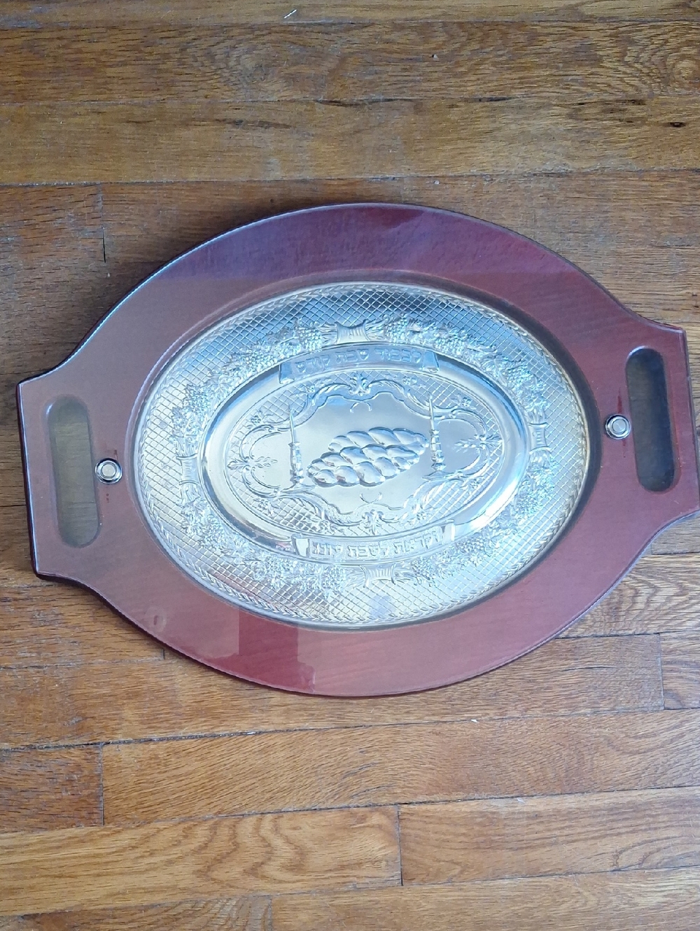 Oval Challah board featuring silver-plated center insert with replaceable cover